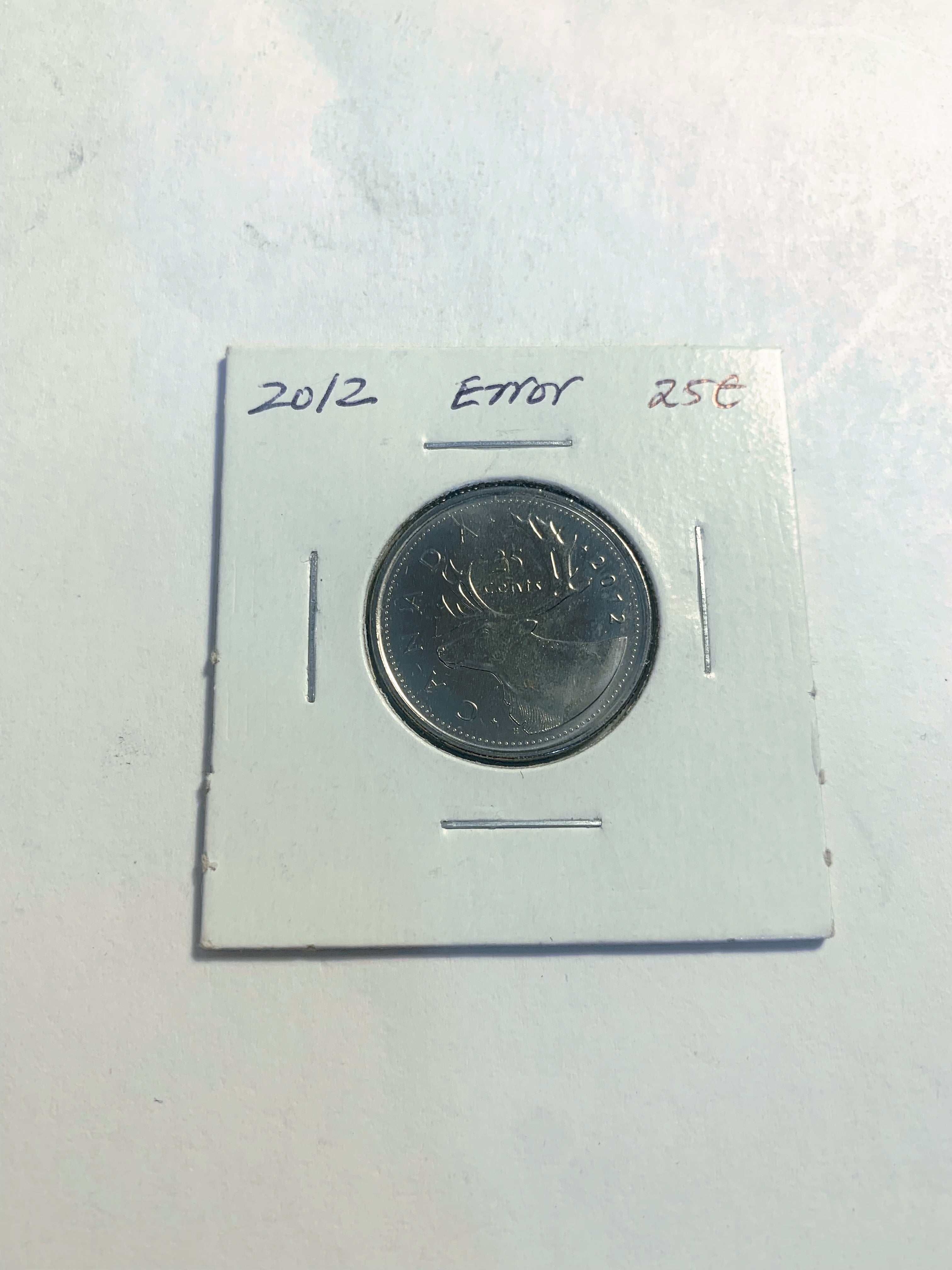 Error 2012 Canadian 25-Cent Caribou Quarter with Damage on obverse